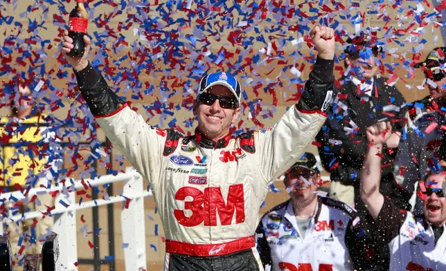 FILE - Greg Biffle celebrates in victory lane after winning the NASCAR Sprint Cup Series auto race at Kansas Speedway on Sunday, Oct. 3, 2010, in Kansas City, Kan. (AP Photo/Orlin Wagner, File)