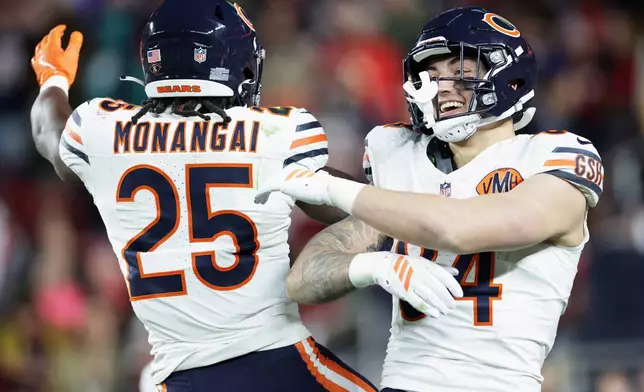 Chicago Bears' Colston Loveland celebrates his touchdown catch with Kyle Monangai during the first half of an NFL football game the San Francisco 49ers in Santa Clara, Calif., Sunday, Dec. 28, 2025. (Scott Strazzante/San Francisco Chronicle via AP)