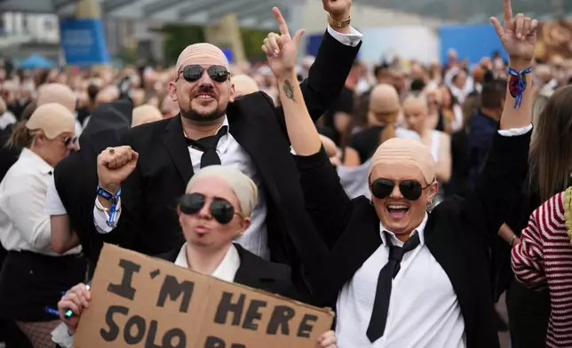 FILE - Fans gather in front of the O2 Arena prior to a performance by Pitbull on Monday, June 9, 2025, in London. (Photo by Scott A Garfitt/Invision/AP, File)