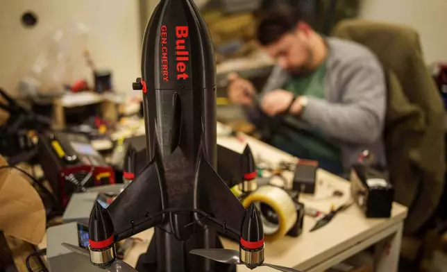 An engineer assembles interceptor drone of "General Cherry" company at the workshop in Ukraine, on Dec. 4, 2025. (AP Photo/Evgeniy Maloletka)
