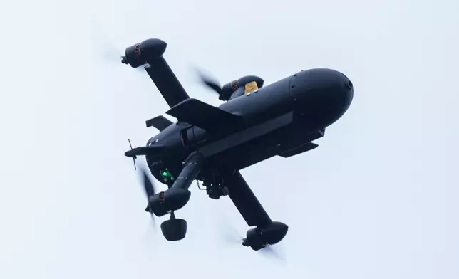 An interceptor drone of "General Cherry" company flys at the polygon in Ukraine, on Dec. 4, 2025. (AP Photo/Evgeniy Maloletka)