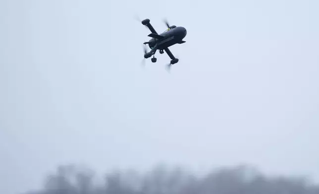 An interceptor drone of "General Cherry" company flys at the polygon in Ukraine, on Dec. 4, 2025. (AP Photo/Evgeniy Maloletka)