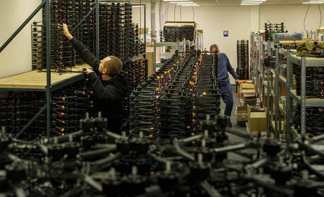 An engineer collects FPV drones of "General Cherry" company at the workshop in Ukraine, on Dec. 4, 2025. (AP Photo/Evgeniy Maloletka)
