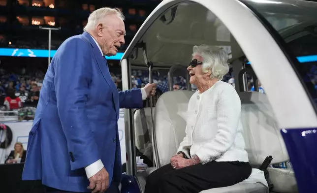 Dallas Cowboys owner Jerry Jones, left, talks with Detroit Lions owner Martha Ford prior to an NFL football game Thursday, Dec. 4, 2025, in Detroit. (AP Photo/Ryan Sun)