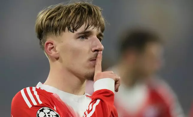 Bayern's Lennart Karl celebrates after scoring his side's second goal during the Champions League opening phase soccer match between FC Bayern Munich and Sporting CP in Munich, Germany, Tuesday, Dec. 9, 2025. (AP Photo/Matthias Schrader)