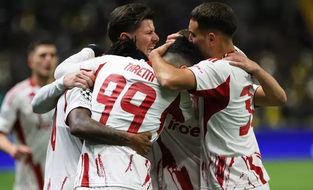 Olympiacos' players celebrates after scoring their side's first goal during the Champions League, opening phase soccer match between Kairat Almaty and Olympiacos in Astana, Kazakhstan, Tuesday, Dec. 9, 2025, 2025. (AP Photo/Alikhan Sariyev)