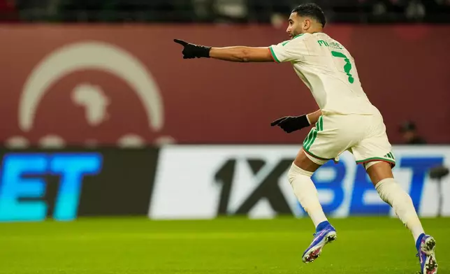 Algeria's Riyad Karim Mahrez celebrates after scoring his side's first goal during the Africa Cup of Nations group E soccer match between Algeria and Burkina Faso in Fez, Morocco, Sunday, Dec. 28, 2025. (AP Photo/Mosa'ab Elshamy)