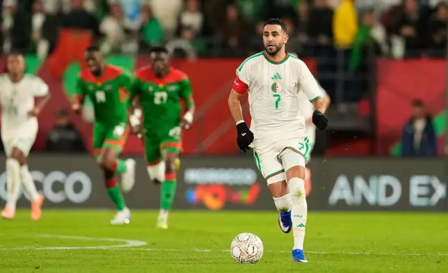 Algeria's Riyad Karim Mahrez controls the ball during the Africa Cup of Nations group E soccer match between Algeria and Burkina Faso in Rabat, Morocco, Sunday, Dec. 28, 2025. (AP Photo/Mosa'ab Elshamy)