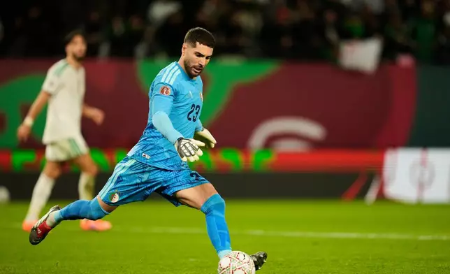 Algeria's goalkeeper Luca Zidane kicks the ball during the Africa Cup of Nations group E soccer match between Algeria and Burkina Faso in Rabat, Morocco, Sunday, Dec. 28, 2025. (AP Photo/Mosa'ab Elshamy)