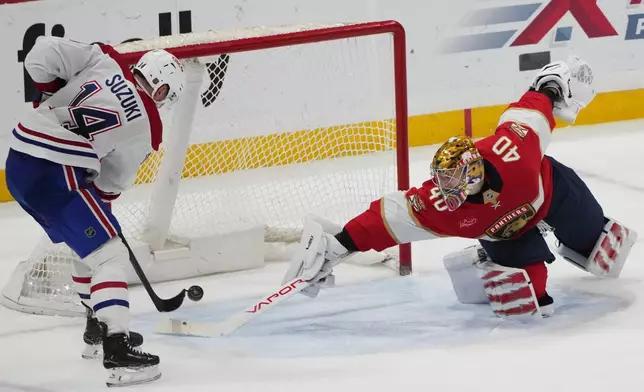 Montréal Canadiens center Nick Suzuki (14) scores the game winning goal against Florida Panthers goaltender Daniil Tarasov (40) during overtime in an NHL hockey game, Tuesday, Dec. 30, 2025, in Sunrise, Fla. (AP Photo/Lynne Sladky)