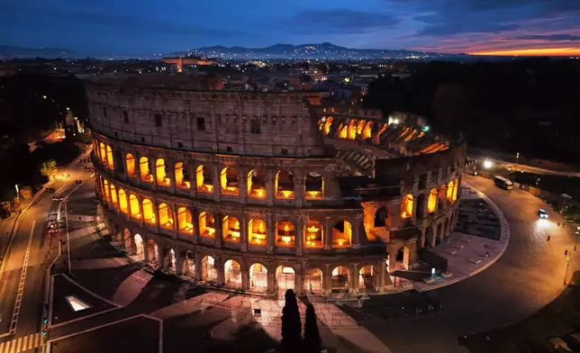 An aerial view of the Colosseum at sunrise, in Rome, Thursday, Dec. 4, 2025. (AP Photo/Alessandra Tarantino)