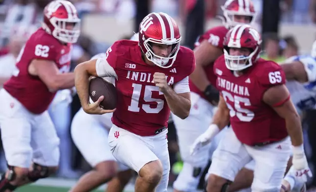 FILE - Indiana quarterback Fernando Mendoza (15) runs during the first half of an NCAA college football game against Indiana State, Friday, Sept. 12, 2025, in Bloomington, Ind. (AP Photo/Darron Cummings, File)
