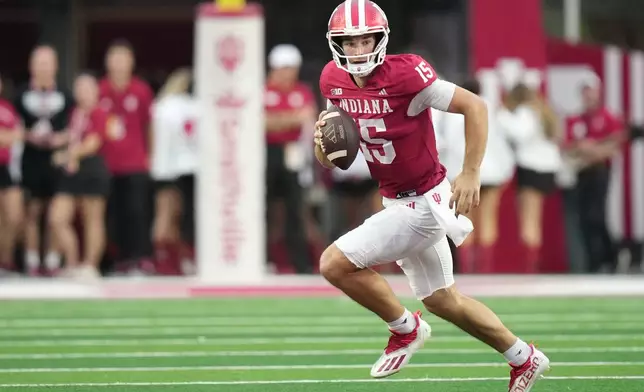 FILE - Indiana quarterback Fernando Mendoza (15) runs during the first half of an NCAA college football game against the Michigan State, Saturday, Oct. 18, 2025, in Bloomington, Ind. (AP Photo/AJ Mast, File)