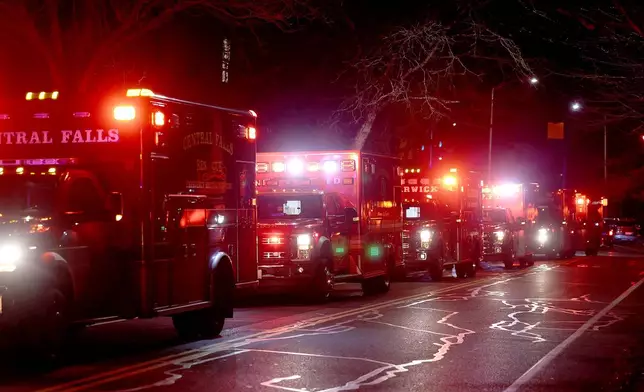 Ambulances line Hope Street at Brown University in Providence, R.I., Saturday, Dec. 13, 2025, during reports of a shooting. (AP Photo/Mark Stockwell)