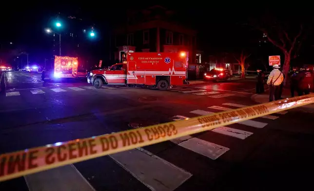 Emergency personnel gather at Hope and Waterman Streets at Brown University in Providence, R.I., Saturday, Dec. 13, 2025, during reports of a shooting. (AP Photo/Mark Stockwell)