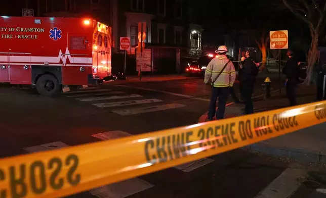 Emergency personnel gather at Hope and Waterman Streets at Brown University in Providence, R.I., Saturday, Dec. 13, 2025, during reports of a shooting. (AP Photo/Mark Stockwell)