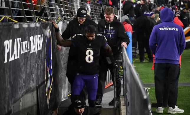 Baltimore Ravens quarterback Lamar Jackson (8) leaves the field during the first half of an NFL football game against the New England Patriots, Sunday, Dec. 21, 2025, in Baltimore. (AP Photo/Nick Wass)