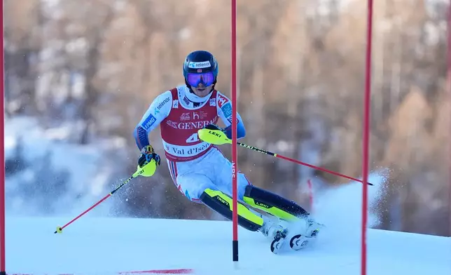 Norway's Atle Lie McGrath speeds down the course during an alpine ski, men's World Cup slalom event, in Val d'Isere, France, Sunday Dec. 14, 2025. (AP Photo/Giovanni Auletta)