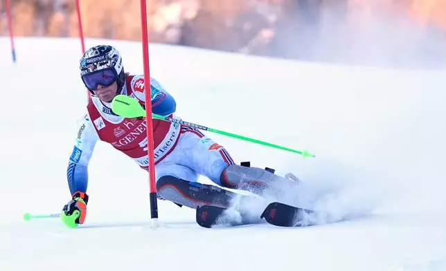 Norway's Timon Haugan speeds down the course during an alpine ski, men¥s World Cup slalom event, in Val d¥Isere, France, Sunday Dec. 14, 2025. (AP Photo/Giovanni Auletta)