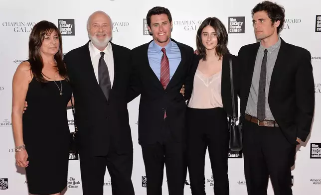 CORRECTS IDENTITY OF NICK AND JAKE REINER - FILE - Honoree Rob Reiner, second left, poses with his wife Michele, left, and children Jake, center, Romy, and Nick at the 41st annual Chaplin Award Gala at Avery Fisher Hall, April 28, 2014, in New York. (Photo by Evan Agostini/Invision/AP, File)