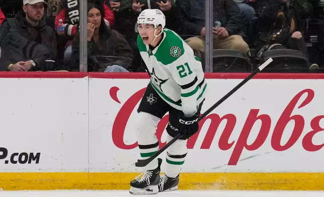 Dallas Stars' Jason Robertson reacts after scoring during the second period of an NHL hockey game against the New Jersey Devils in Newark, N.J., Wednesday, Dec. 3, 2025. (AP Photo/Seth Wenig)