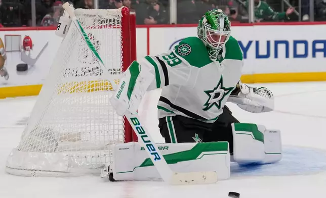 Dallas Stars goaltender Jake Oettinger defends the net during the second period of an NHL hockey game against the New Jersey Devils in Newark, N.J., Wednesday, Dec. 3, 2025. (AP Photo/Seth Wenig)