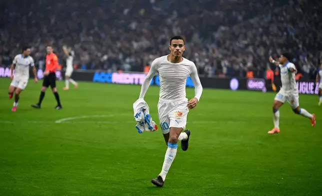 Marseille's Mason Greenwood celebrates scoring during the French League One soccer match between Marseille and Monaco in Marseille, France, Sunday, Dec. 14, 2025. (AP Photo/Philippe Magoni)