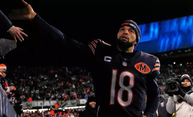 Chicago Bears' Caleb Williams celebrates after overtime of an NFL football game against the Green Bay Packers Saturday, Dec. 20, 2025, in Chicago. (AP Photo/Nam Huh)
