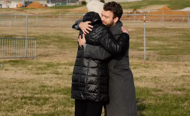 Bebe Harton, left, and Sam Shideler, right, hug in the area reserved for anti-death penalty demonstrators outside Riverbend Maximum Security Institution before the execution of Harold Wayne Nichols, Thursday, Dec. 11, 2025, in Nashville, Tenn. (AP Photo/George Walker IV)