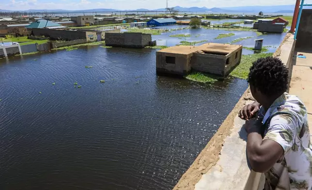 Residential buildings are submerged after Lake Naivasha swelled and flooded homes, in Kihoto Village, in Naivasha, Kenya's Rift Valley region, Tuesday, Nov. 11, 2025. (AP Photo/Andrew Kasuku)