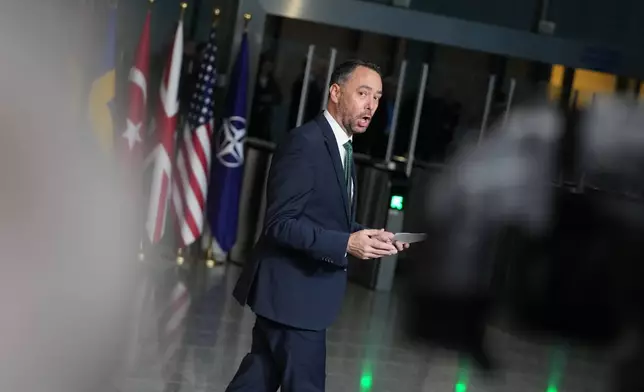 Belgium's Foreign Minister Maxime Prevot speaks with journalists as he arrives for a meeting of NATO foreign ministers at NATO headquarters in Brussels, Wednesday, Dec. 3, 2025. (AP Photo/Virginia Mayo)