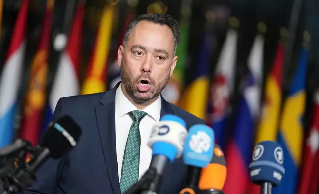 Belgium's Foreign Minister Maxime Prevot speaks with the media as he arrives for a meeting of NATO foreign ministers at NATO headquarters in Brussels, Wednesday, Dec. 3, 2025. (AP Photo/Virginia Mayo)