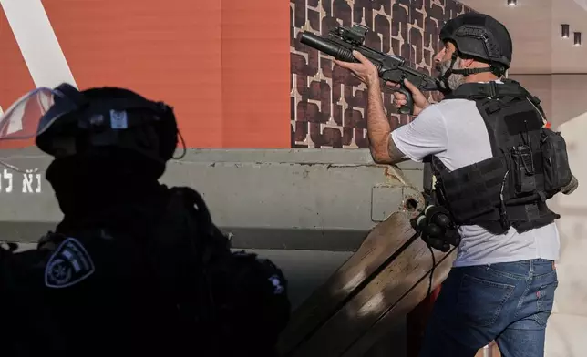 Israeli police officers work to restore order during a violent disturbance by Ultra-Orthodox Jewish protesters in Jerusalem, Thursday, Dec. 18, 2025. (AP Photo/ Mahmoud Illean)