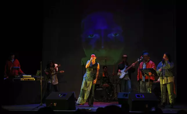 Mexican composer Maria Leonora performs her series she calls “Through All the Fire,” at the Sergio Magaña Theater in Mexico City, Friday, Nov. 28, 2025. (AP Photo/Claudia Rosel)