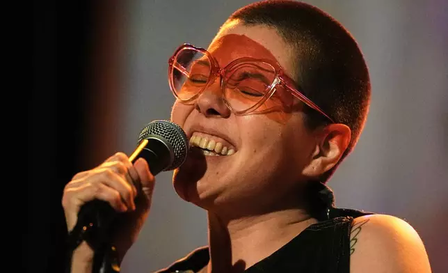 Mexican composer Maria Leonora performs her series she calls “Through All the Fire,” at the Sergio Magaña Theater in Mexico City, Friday, Nov. 28, 2025. (AP Photo/Claudia Rosel)