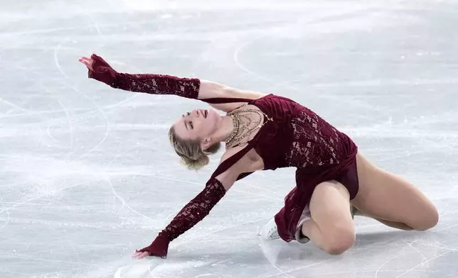 Amber Glenn, of the United States, competes in the women's short program segment at the ISU Grand Prix of Figure Skating Final in Nagoya, central Japan, Friday, Dec. 5, 2025. (AP Photo/Hiro Komae)