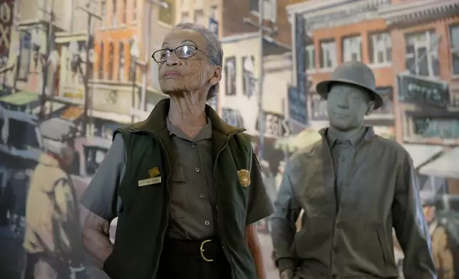 FILE - National Park Service Ranger Betty Reid Soskin works at the visitors center of the Rosie the Riveter/World War II Home Front National Historical Park in Richmond, Calif., July 26, 2016. (AP Photo/Eric Risberg, File)