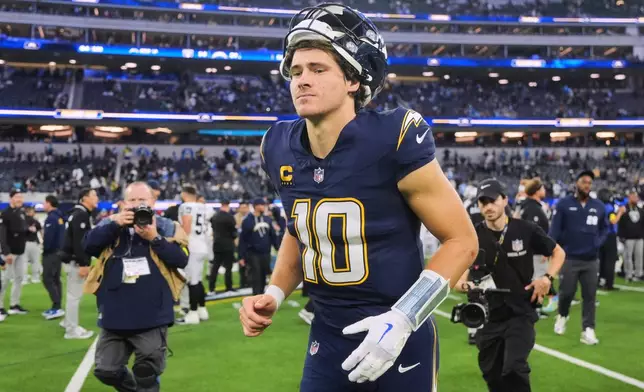 Los Angeles Chargers quarterback Justin Herbert (10) walks off the field after an NFL football game against the Las Vegas Raiders, Sunday, Nov. 30, 2025, in Inglewood, Calif. (AP Photo/Jae C. Hong)