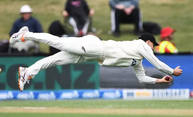 New Zealand's Will Young takes a catch to dismiss West Indies'John Campbell during their cricket test match in Christchurch, New Zealand, Wednesday, Dec. 3, 2025. (Chris Symes/Photosport via AP)