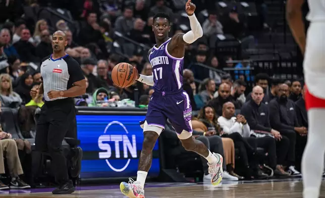 Sacramento Kings guard Dennis Schroder (17) calls a play during the first half an NBA basketball game against the Houston Rockets, Sunday, Dec. 21, 2025, in Sacramento, Calif. (AP Photo/Justine Willard)