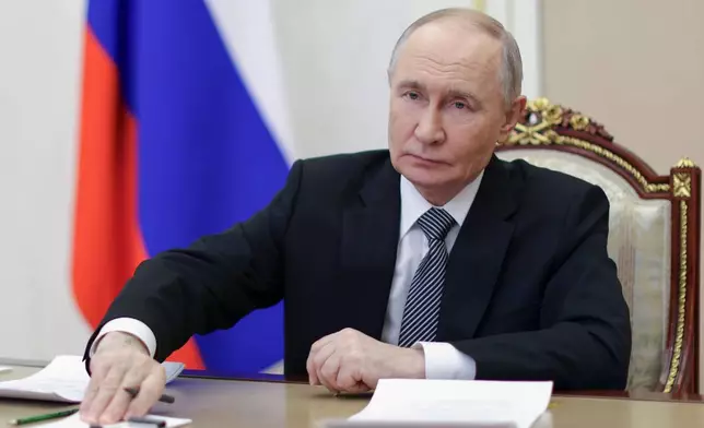 Russian President Vladimir Putin attends a meeting of the Presidential Council for the Development of Civil Society and Human Rights via videoconference at the Kremlin in Moscow, on Tuesday, Dec. 9, 2025. (Gavriil Grigorov, Sputnik, Kremlin Pool Photo via AP)