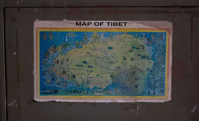 A map of Tibet hangs on the steel wardrobe at a camp in Kathmandu, Nepal, April 15, 2025. (AP Photo/Niranjan Shrestha)