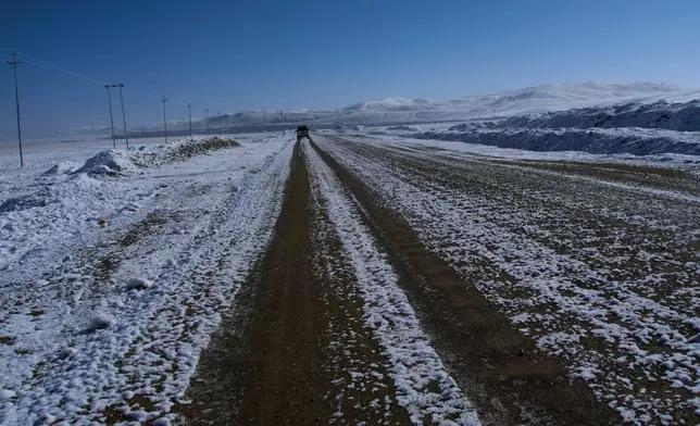 A vehicle carrying domestic tourists is seen approaching the Korola border crossing with China, in Mustang district, Nepal, April 18, 2025. (AP Photo/Niranjan Shrestha)