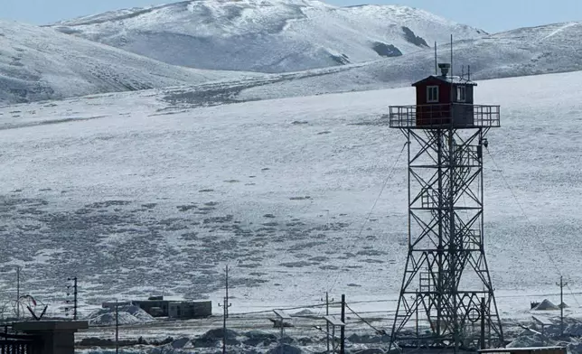 A watchtower with a CCTV camera is seen at the Korola border between Nepal and China in Mustang district, Nepal, Friday, April 18, 2025. (AP Photo/Niranjan Shrestha)