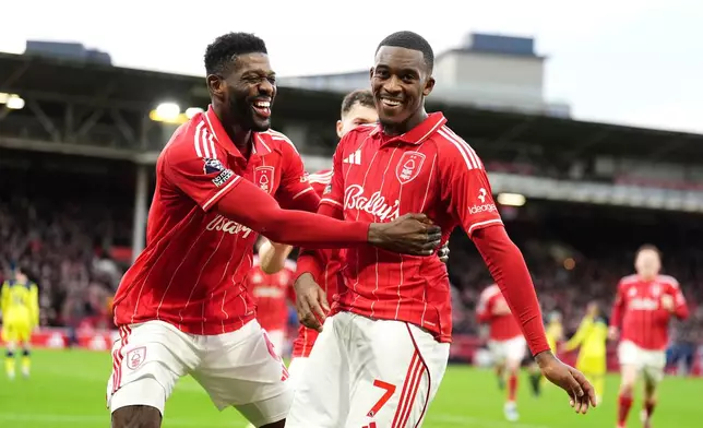 Nottingham Forest's Callum Hudson-Odoi celebrates scoring their side's second goal during their English Premier League soccer match in Nottingham, Sunday, Dec. 14, 2025. (Martin Rickett/PA via AP)