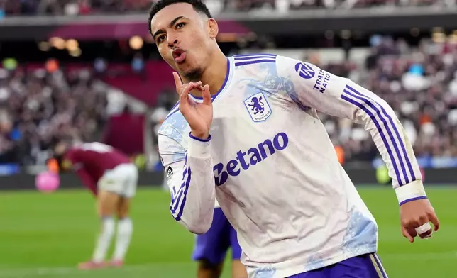 Aston Villa's Morgan Rogers celebrates after scoring his side's second goal during the English Premier League soccer match between West Ham United and Aston Villa in London, England, Sunday, Dec. 14, 2025. (Jonathan Brady/PA via AP)