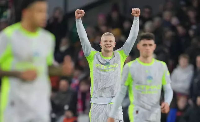 Manchester City's Erling Haaland celebrates after scoring his side's third goal during the English Premier League soccer match between Crystal Palace and Manchester City in London, Sunday, Dec.14, 2025. (AP Photo/Kin Cheung)