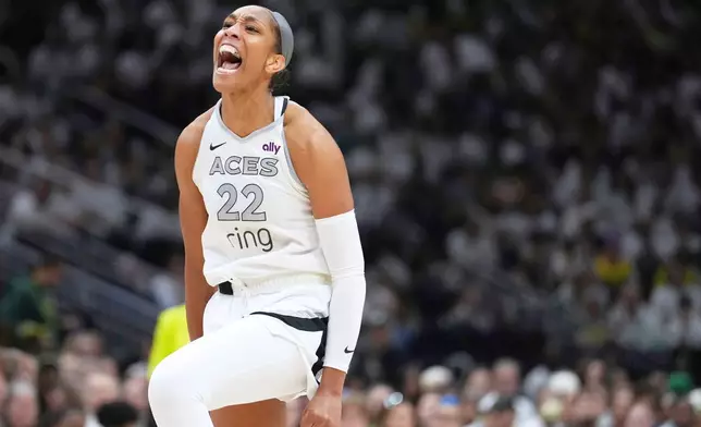 FILE - Las Vegas Aces center A'ja Wilson reacts during the second half of Game 2 against the Seattle Storm in the first round of the WNBA basketball playoffs Tuesday, Sept. 16, 2025, in Seattle. (AP Photo/Lindsey Wasson, File)
