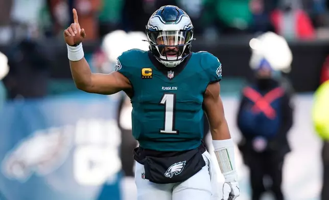Philadelphia Eagles quarterback Jalen Hurts reacts to a touchdown by Eagles tight end Dallas Goedert during the second half of an NFL football game against the Las Vegas Raiders on Sunday, Dec. 14, 2025, in Philadelphia. (AP Photo/Chris Szagola)