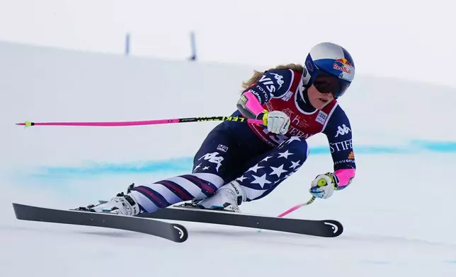 United States' Lindsey Vonn speeds down the course during an alpine ski, women's World Cup super-G in Val d'Isere, France, Sunday, Dec. 21, 2025. (AP Photo/Pier Marco Tacca)